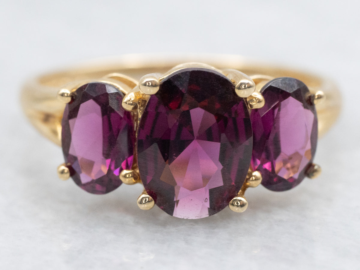 Polished Gold Three Stone Rhodolite Garnet Ring