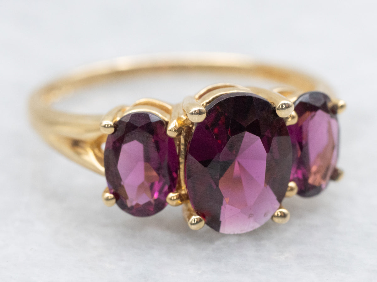 Polished Gold Three Stone Rhodolite Garnet Ring