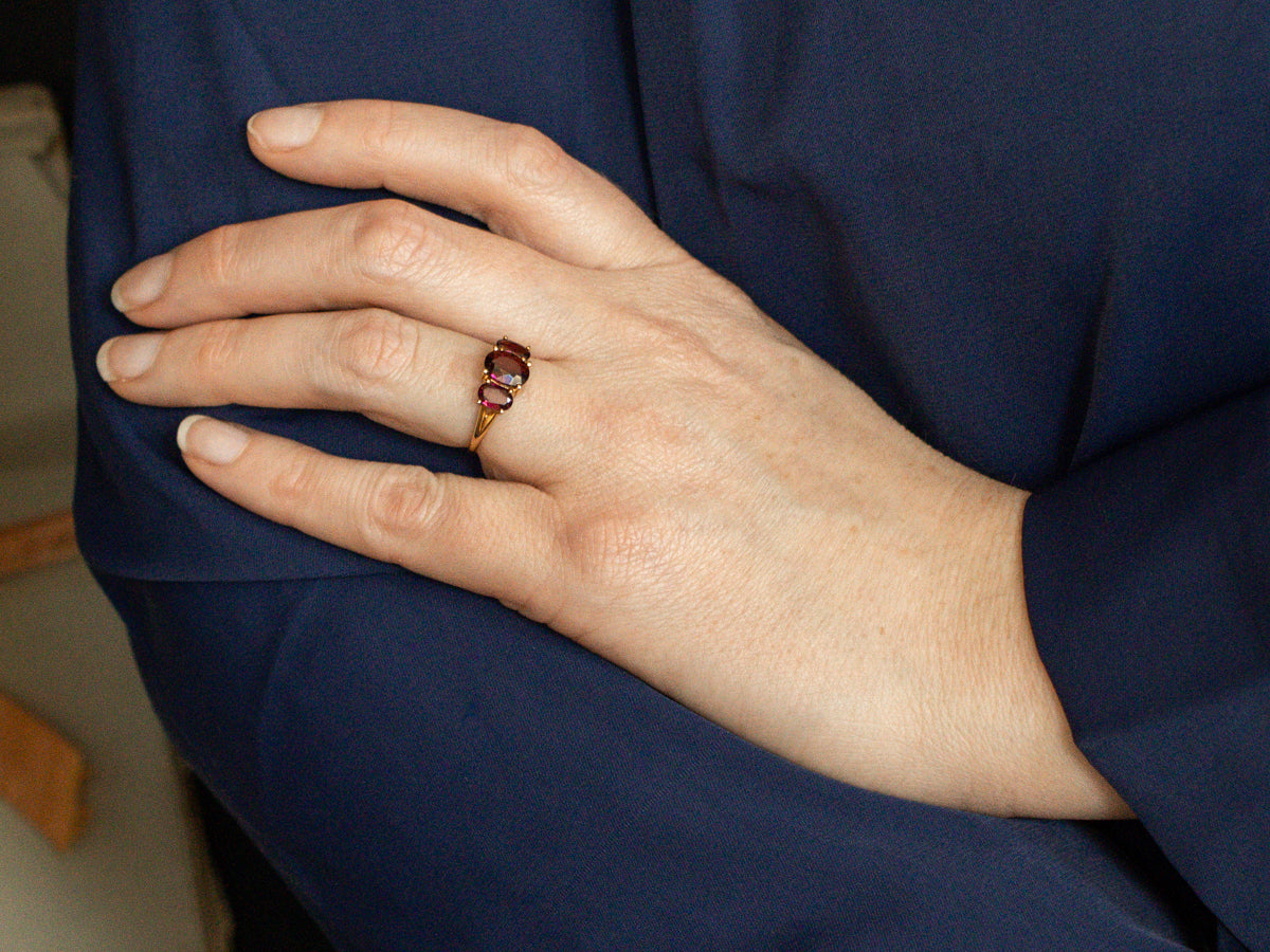 Polished Gold Three Stone Rhodolite Garnet Ring