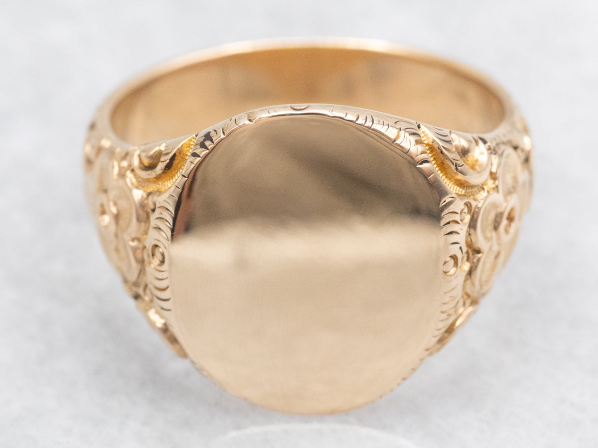 Ornate Oval Top Signet Ring with Floral Shoulders