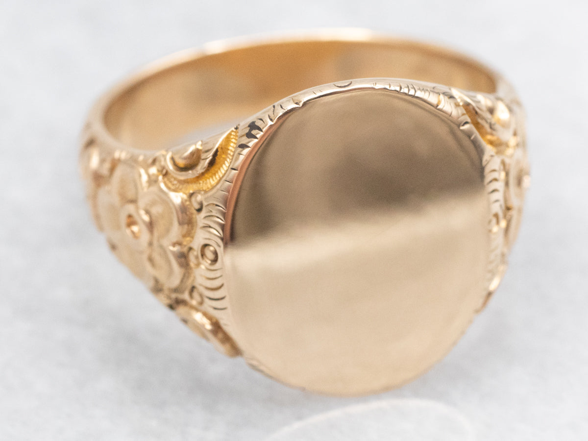 Ornate Oval Top Signet Ring with Floral Shoulders