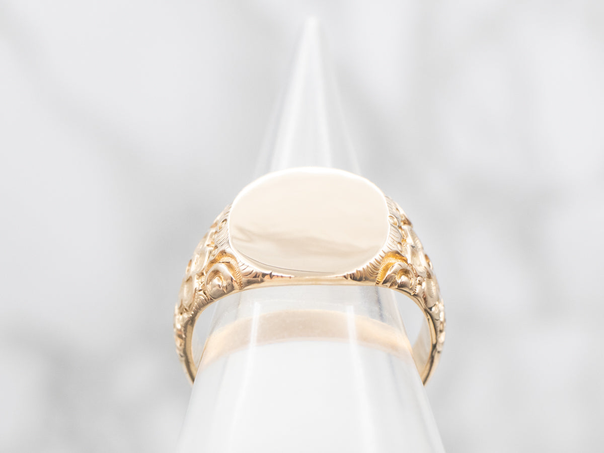 Ornate Oval Top Signet Ring with Floral Shoulders