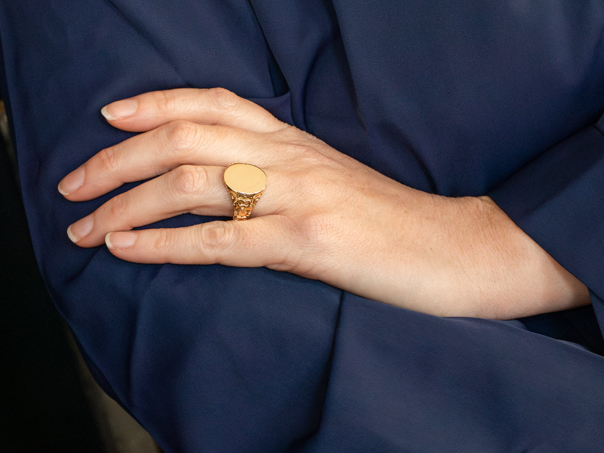 Ornate Oval Top Signet Ring with Floral Shoulders