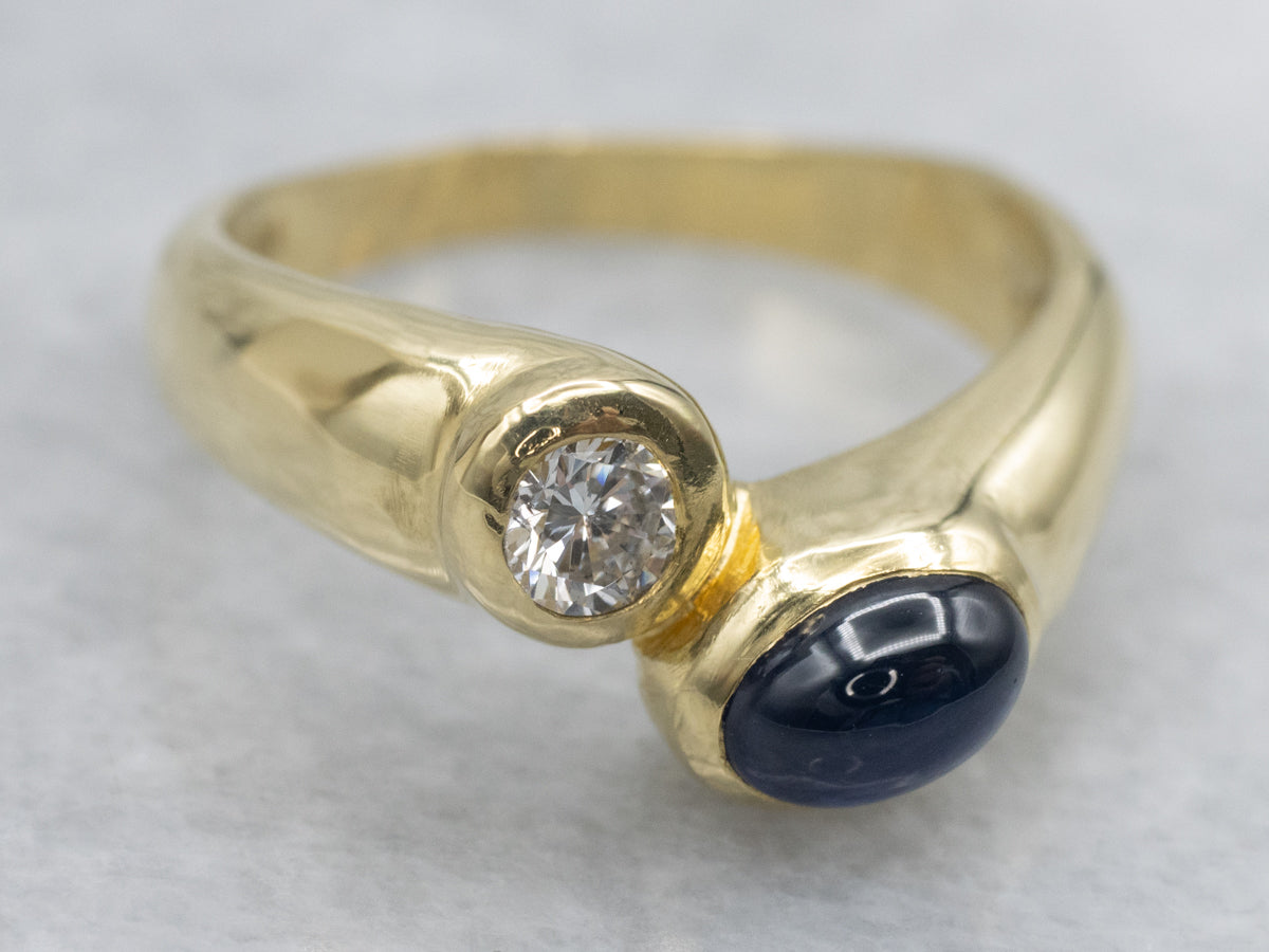 Modernist 18-Karat Gold Sapphire Cabochon and Diamond Bypass Ring