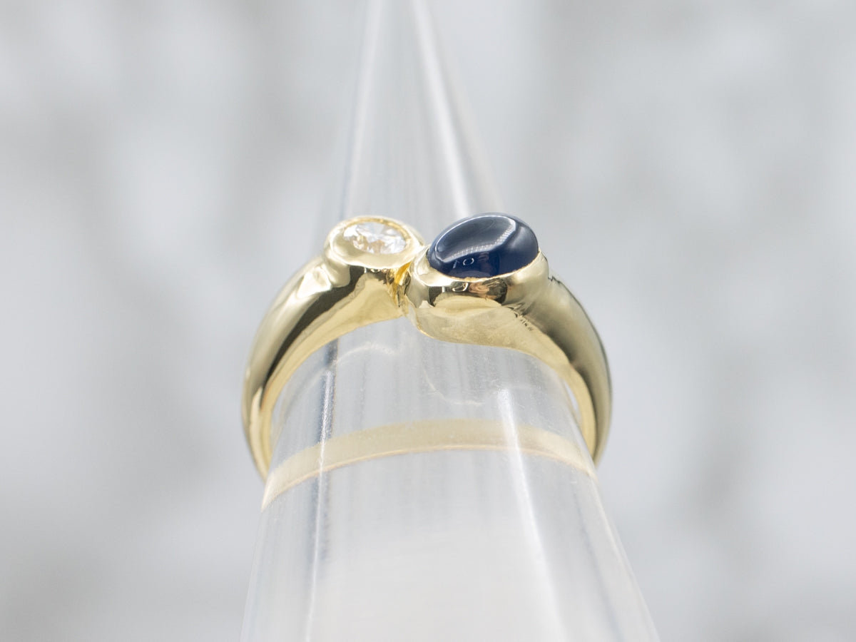 Modernist 18-Karat Gold Sapphire Cabochon and Diamond Bypass Ring
