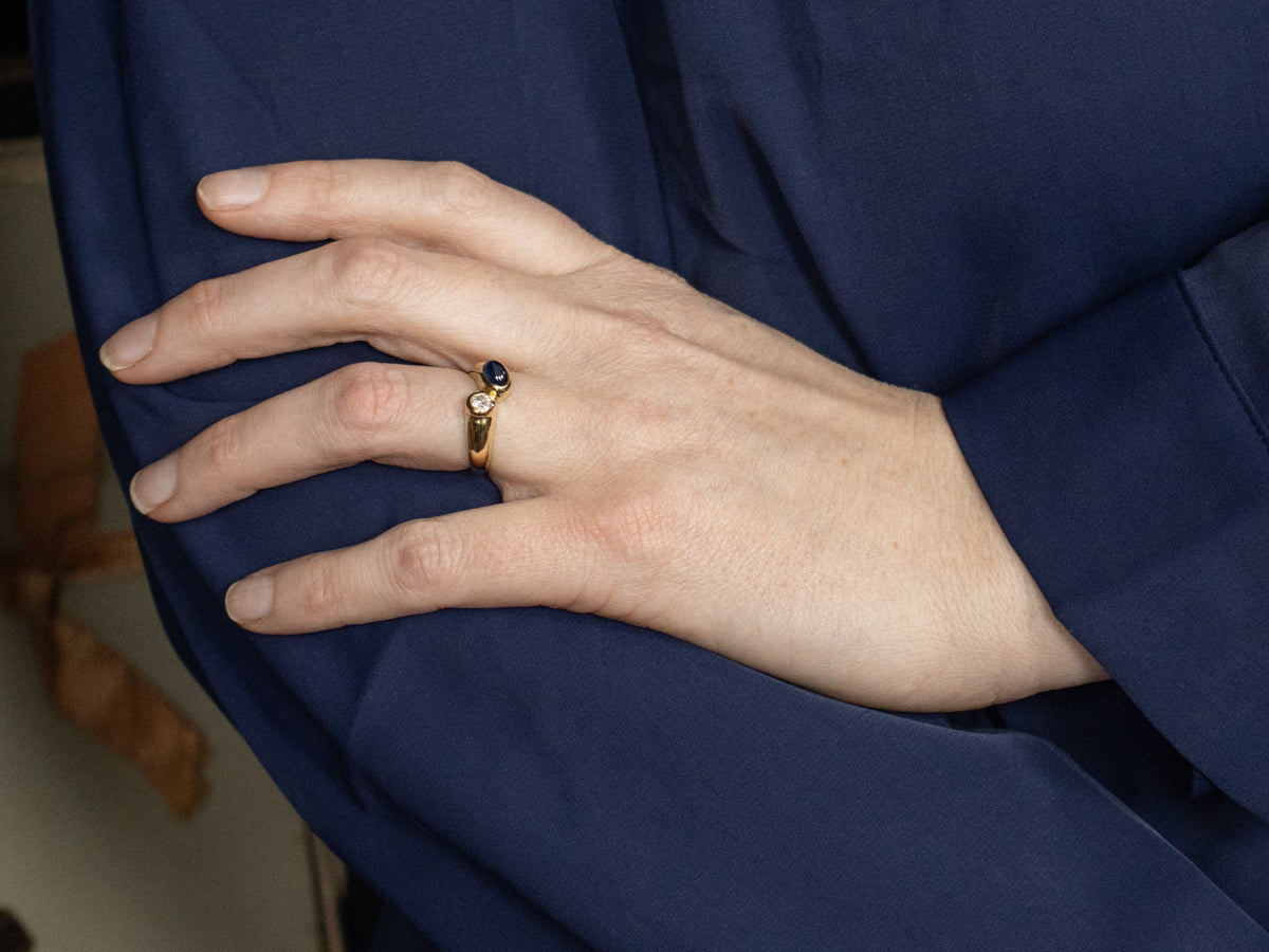 Modernist 18-Karat Gold Sapphire Cabochon and Diamond Bypass Ring