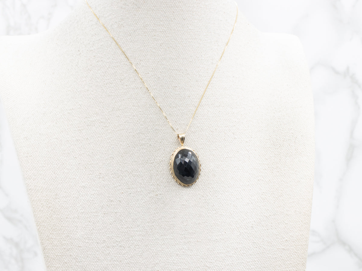 Faceted Obsidian Solitaire Pendant with Twisted Frame