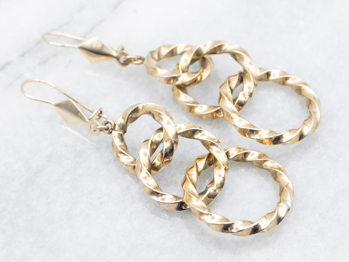 Twisting Graduating Gold Ring Drop Earrings
