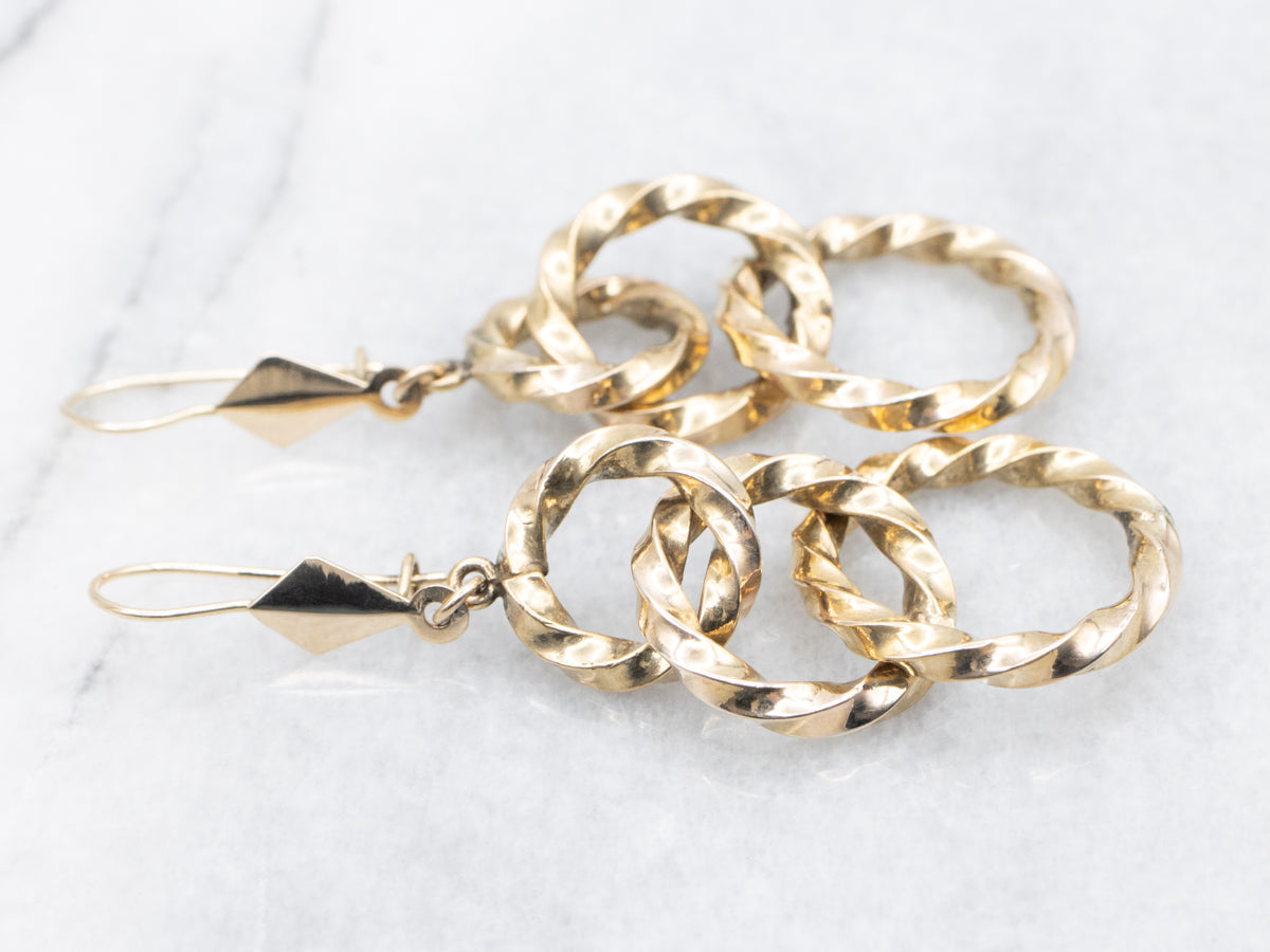 Twisting Graduating Gold Ring Drop Earrings