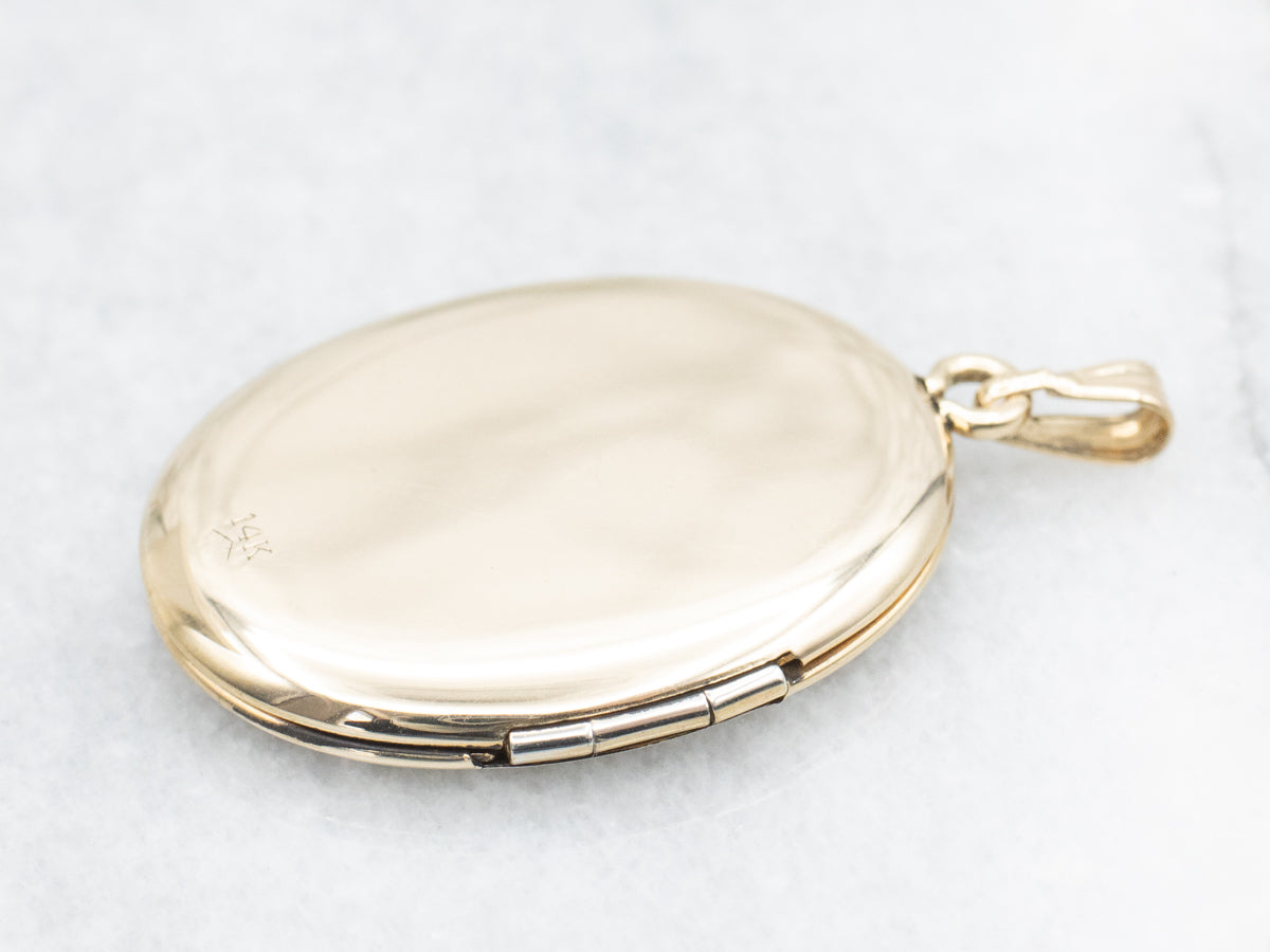Large Gold Oval Locket with Floral Motifs