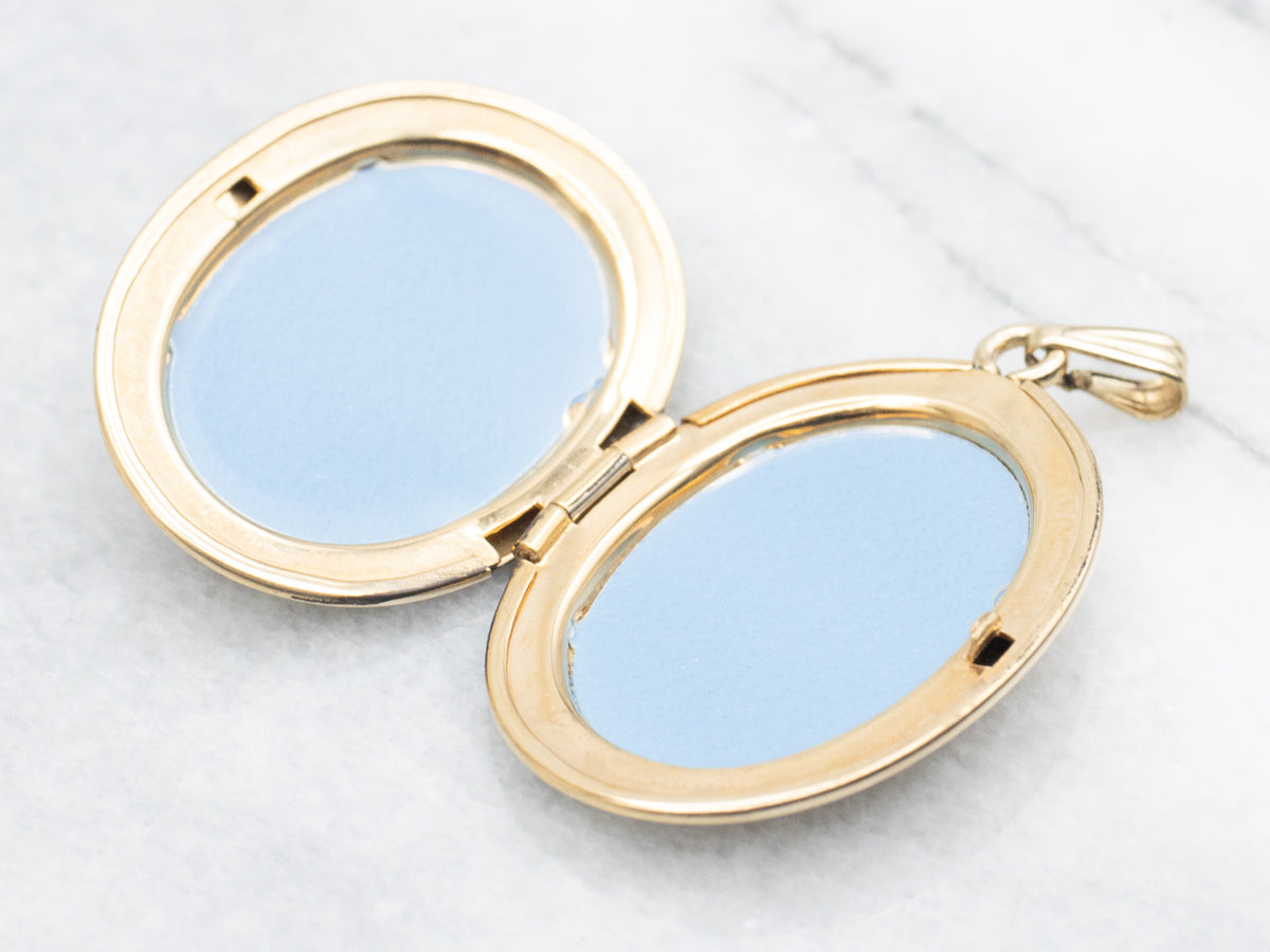 Large Gold Oval Locket with Floral Motifs