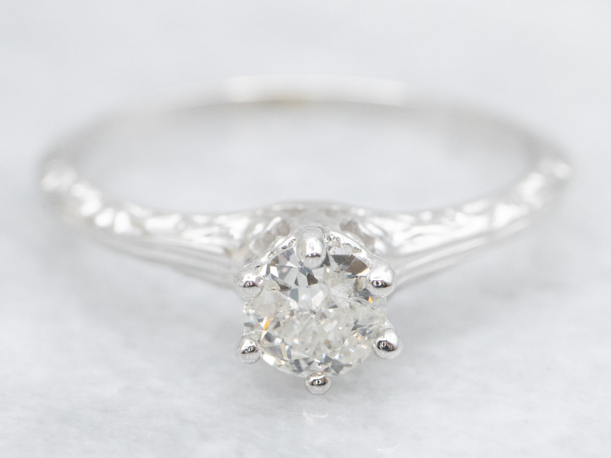 Ornate Diamond Solitaire Engagement Ring with Etched Shoulders