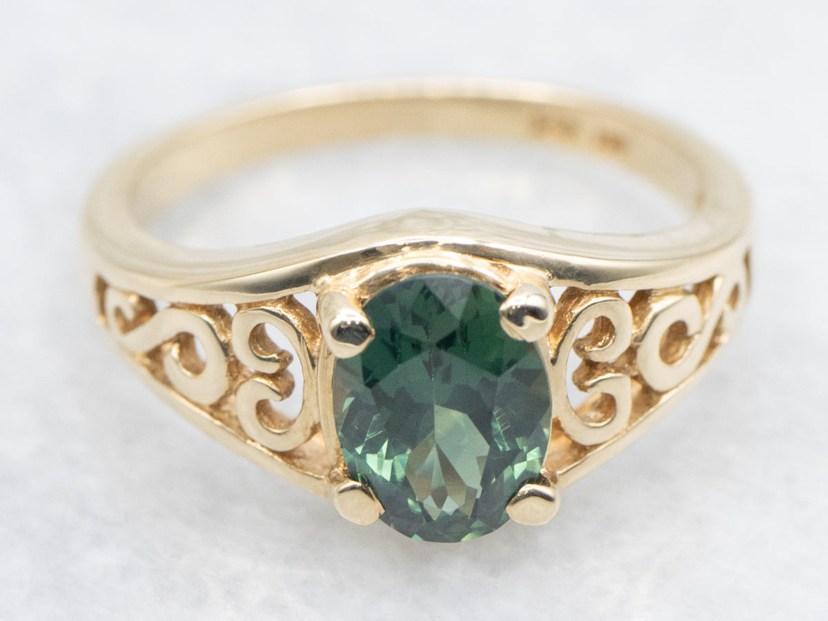 Blue-Green Sapphire Solitaire in Gold Filigree Setting