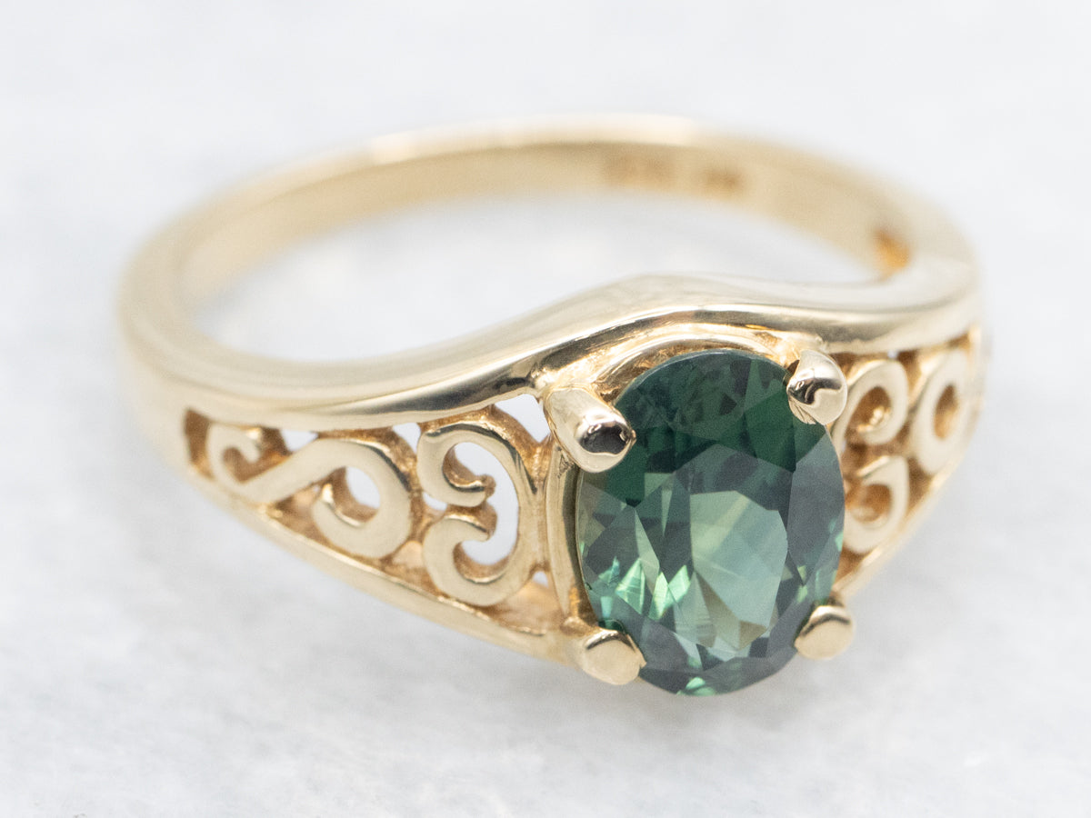 Blue-Green Sapphire Solitaire in Gold Filigree Setting