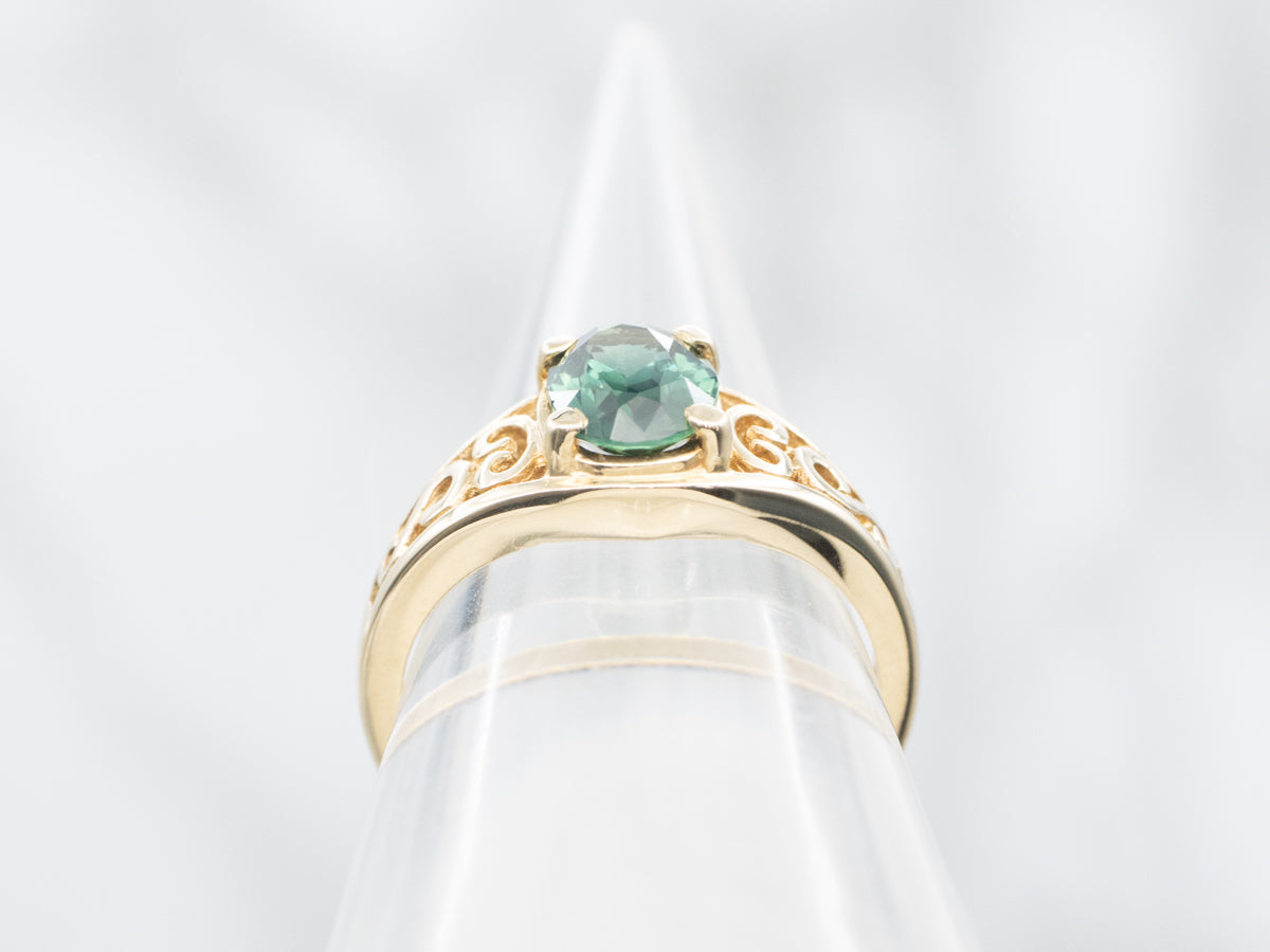 Blue-Green Sapphire Solitaire in Gold Filigree Setting
