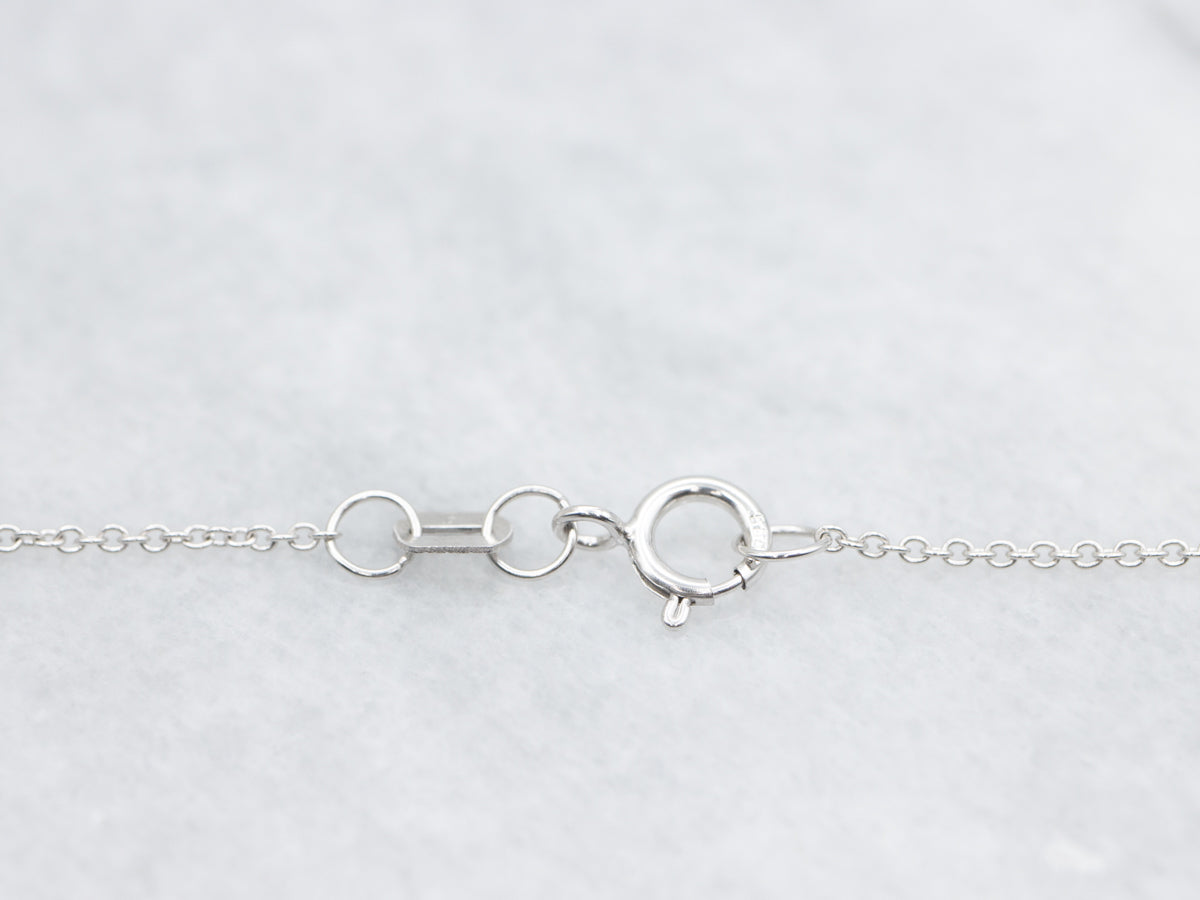 Modern Gold Sapphire and Diamond Halo Pendant Necklace