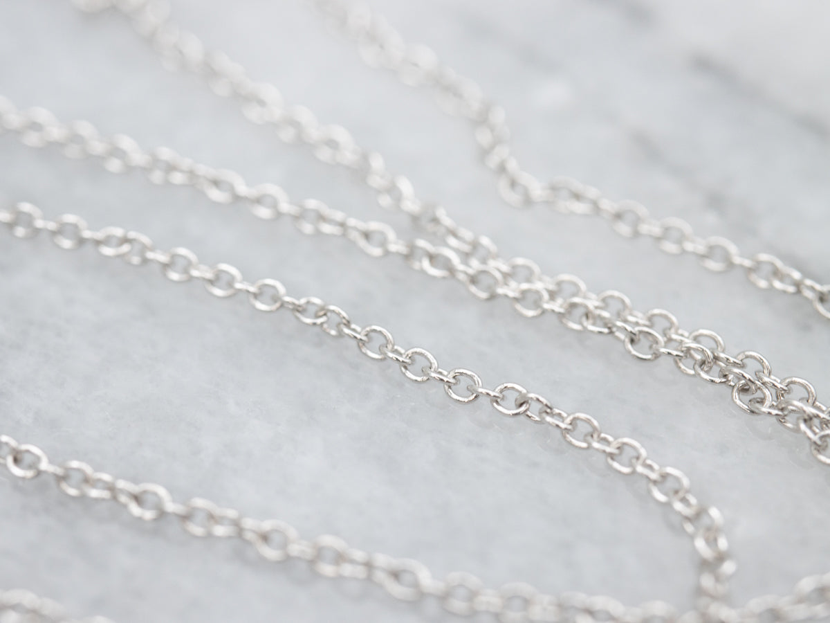 Modern Gold Sapphire and Diamond Halo Pendant Necklace