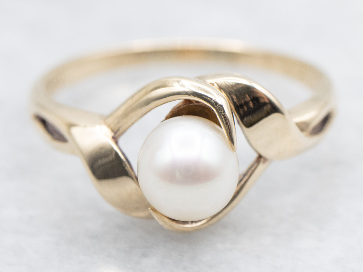 Twisting Gold and Pearl Solitaire Ring