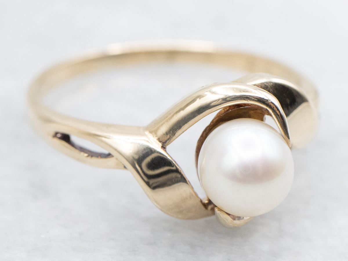 Twisting Gold and Pearl Solitaire Ring