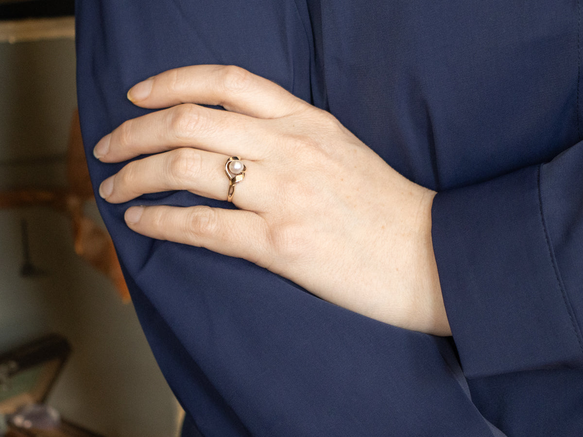 Twisting Gold and Pearl Solitaire Ring