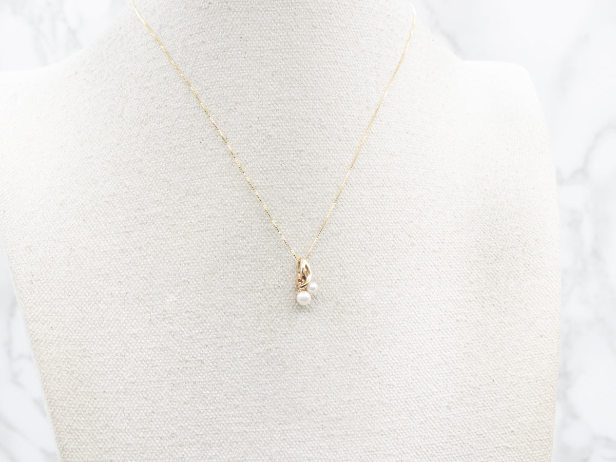 Gold Looping Saltwater Pearl and Ruby Pendant