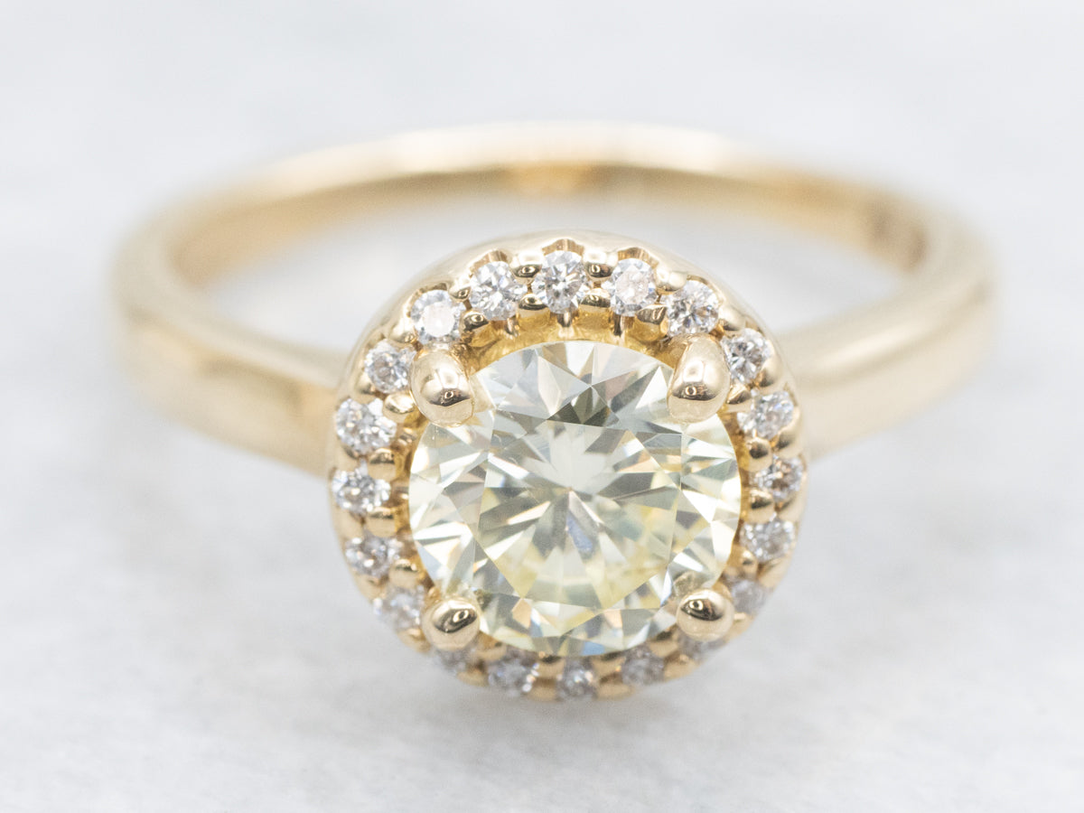 Modern Fancy Yellow Hued Diamond Halo Engagement Ring