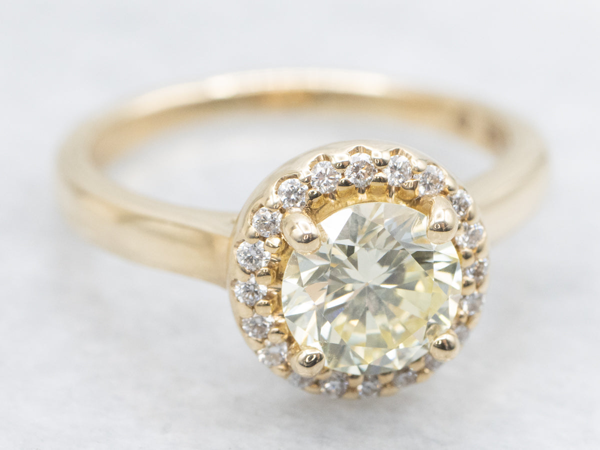 Modern Fancy Yellow Hued Diamond Halo Engagement Ring
