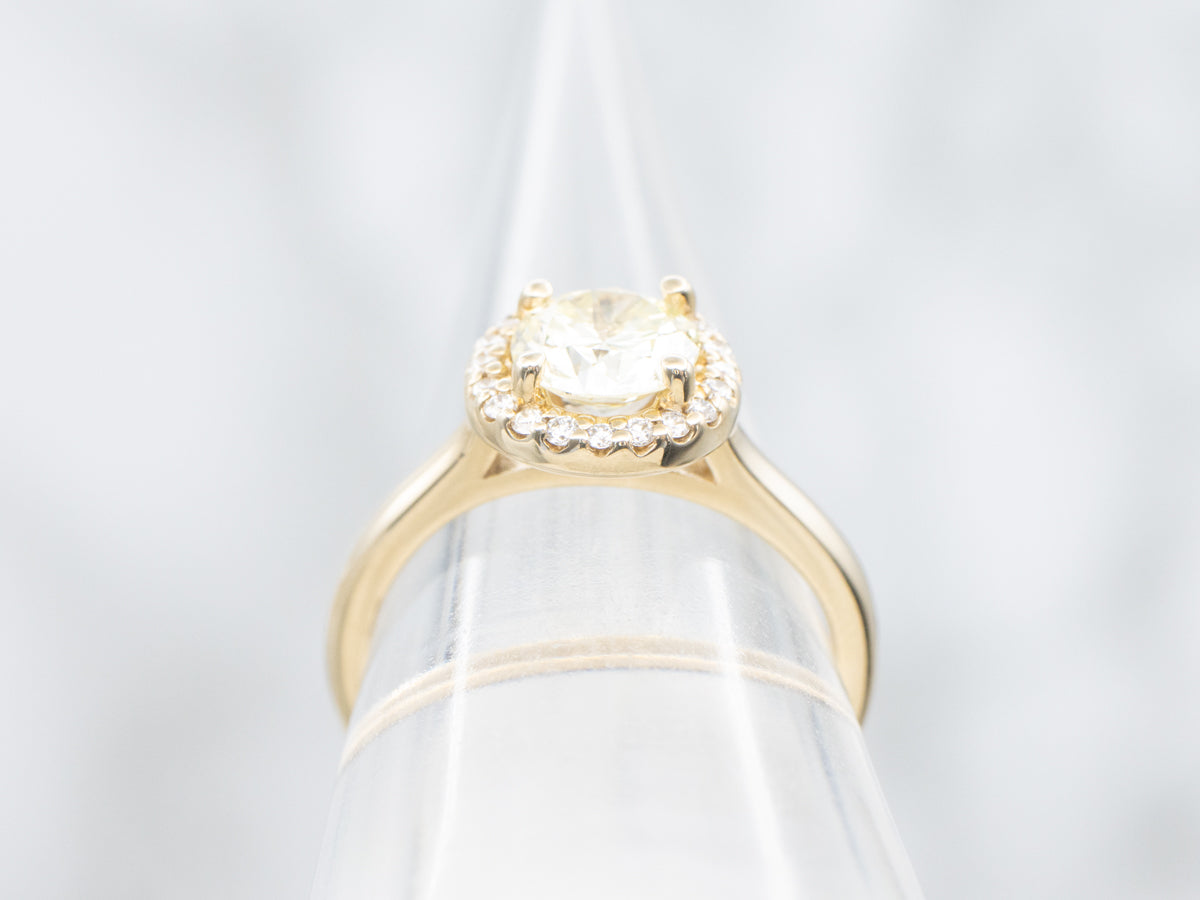 Modern Fancy Yellow Hued Diamond Halo Engagement Ring