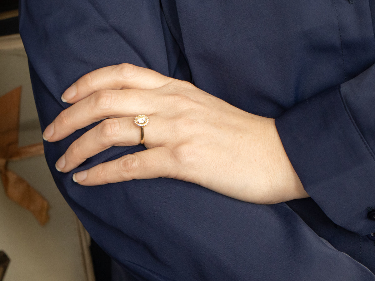 Modern Fancy Yellow Hued Diamond Halo Engagement Ring