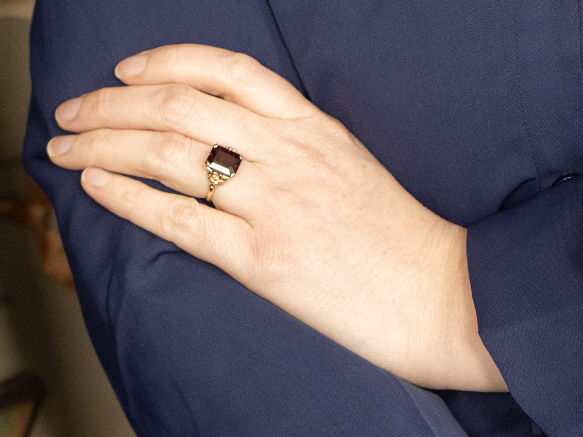 Vintage Gold and Garnet Ring with Flower Detail