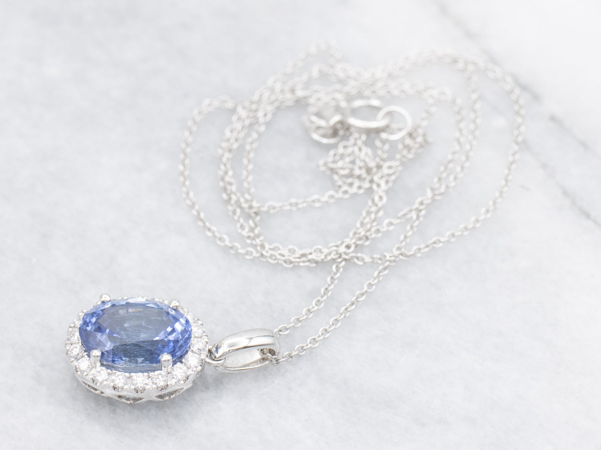 Blue Sapphire and Diamond Halo Pendant Necklace