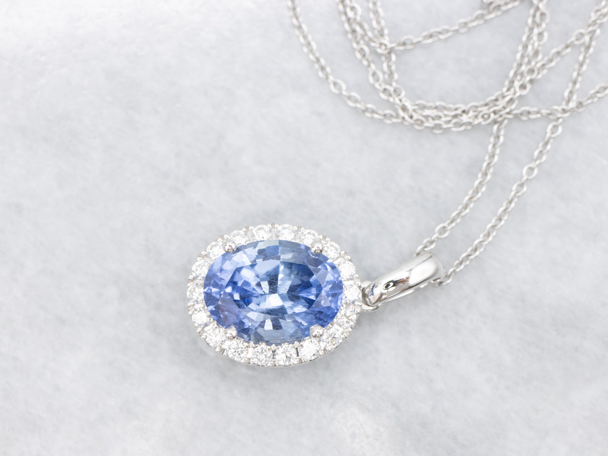 Blue Sapphire and Diamond Halo Pendant Necklace