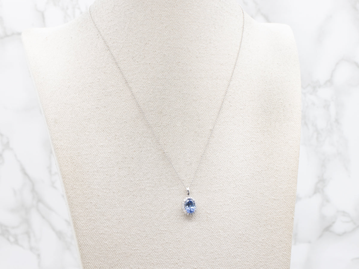 Blue Sapphire and Diamond Halo Pendant Necklace