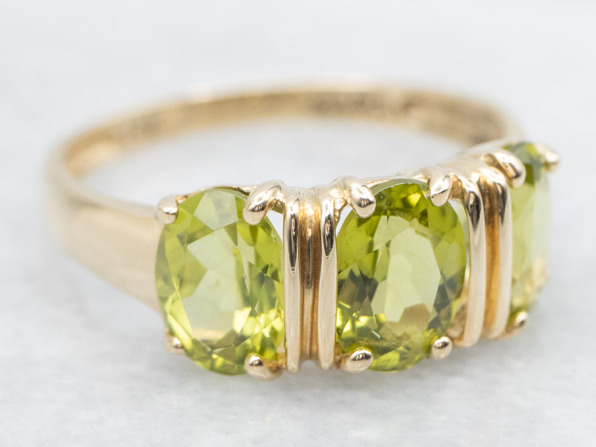 Three Stone Gold and Peridot Ring