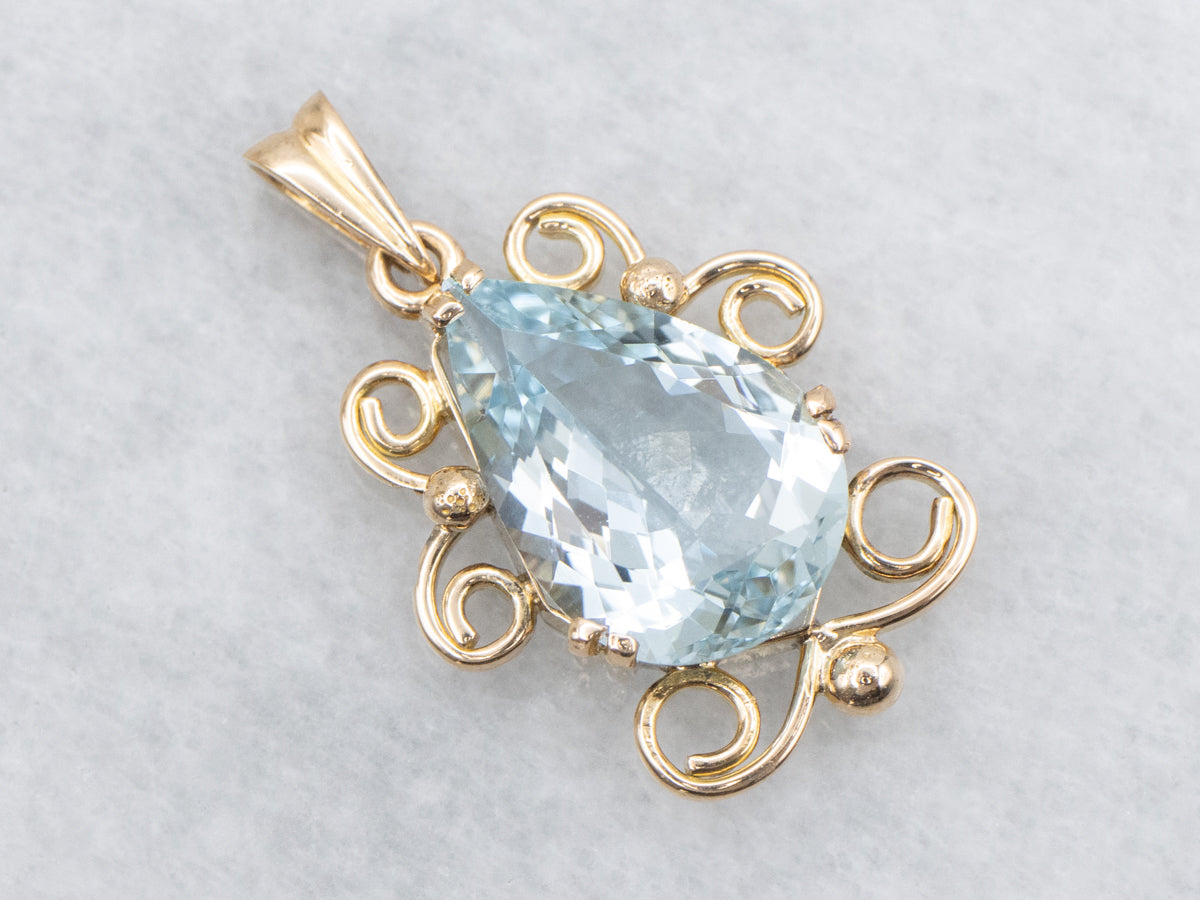 Pear Cut Aquamarine Pendant in Scrolling Gold Frame