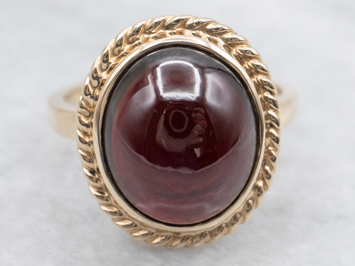 Garnet Cabochon Ring with Twisted Frame
