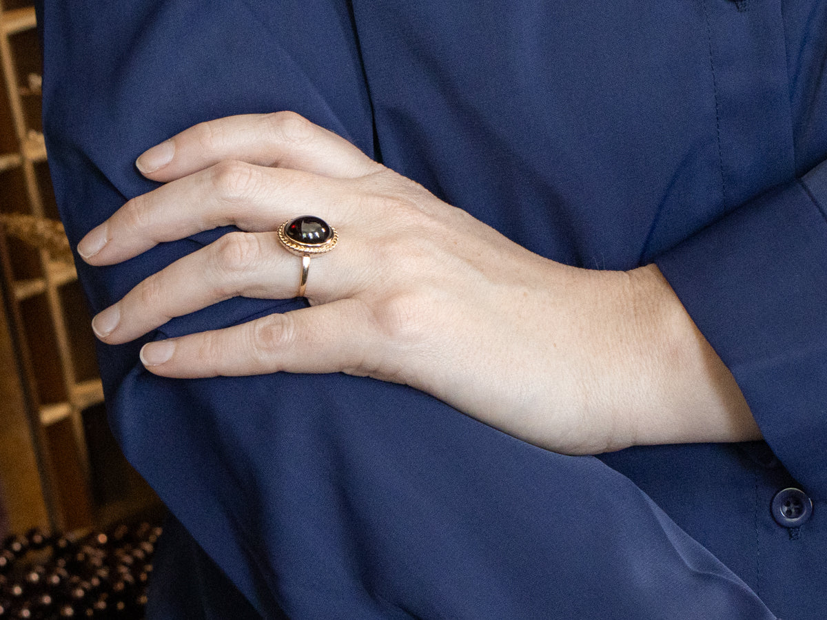 Garnet Cabochon Ring with Twisted Frame