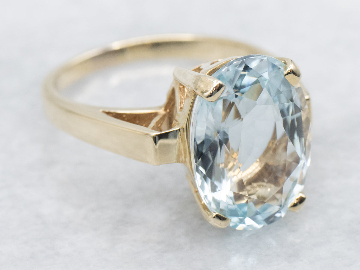 Minimalist Blue Topaz and Gold Solitaire Ring