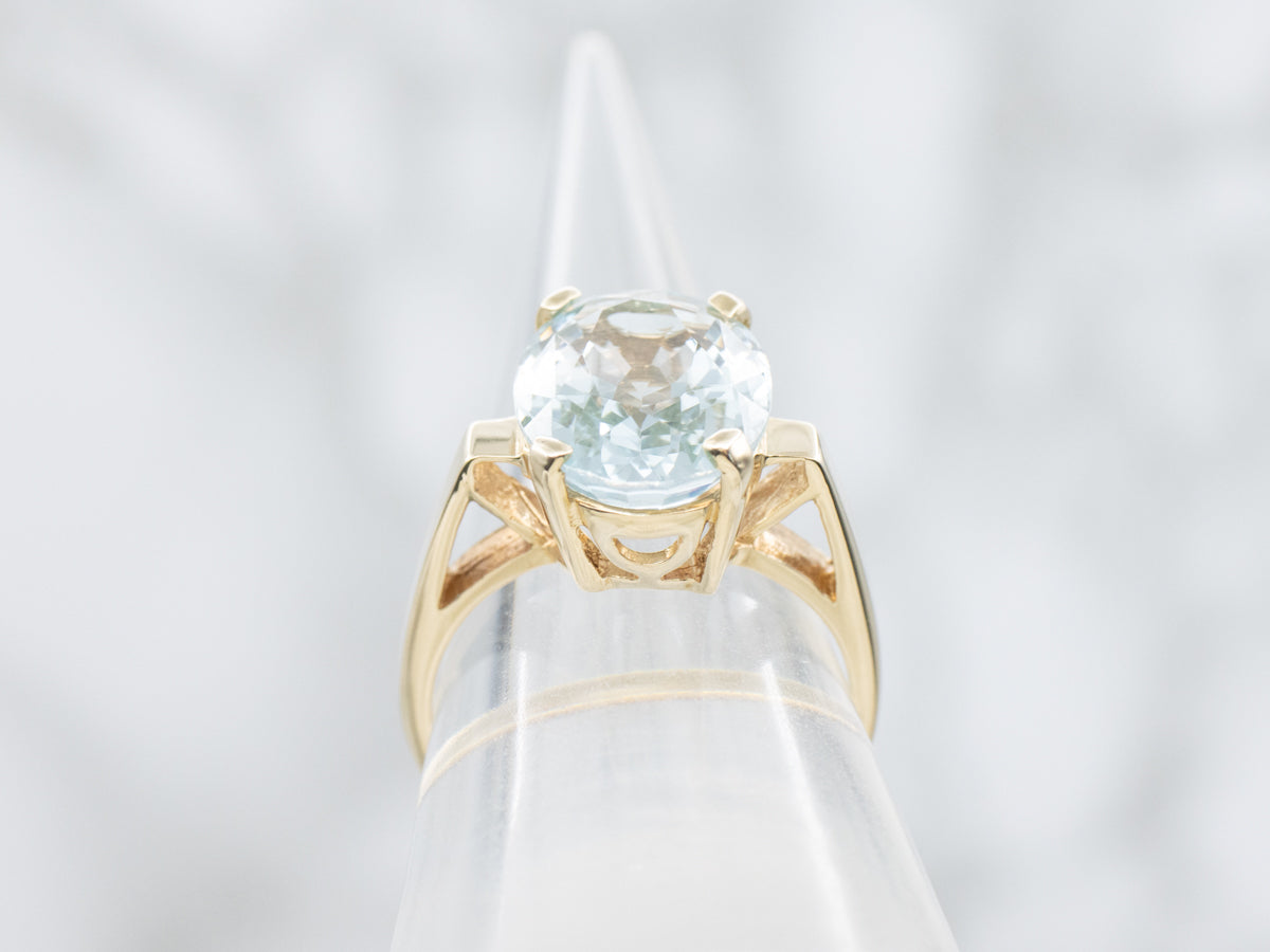 Minimalist Blue Topaz and Gold Solitaire Ring