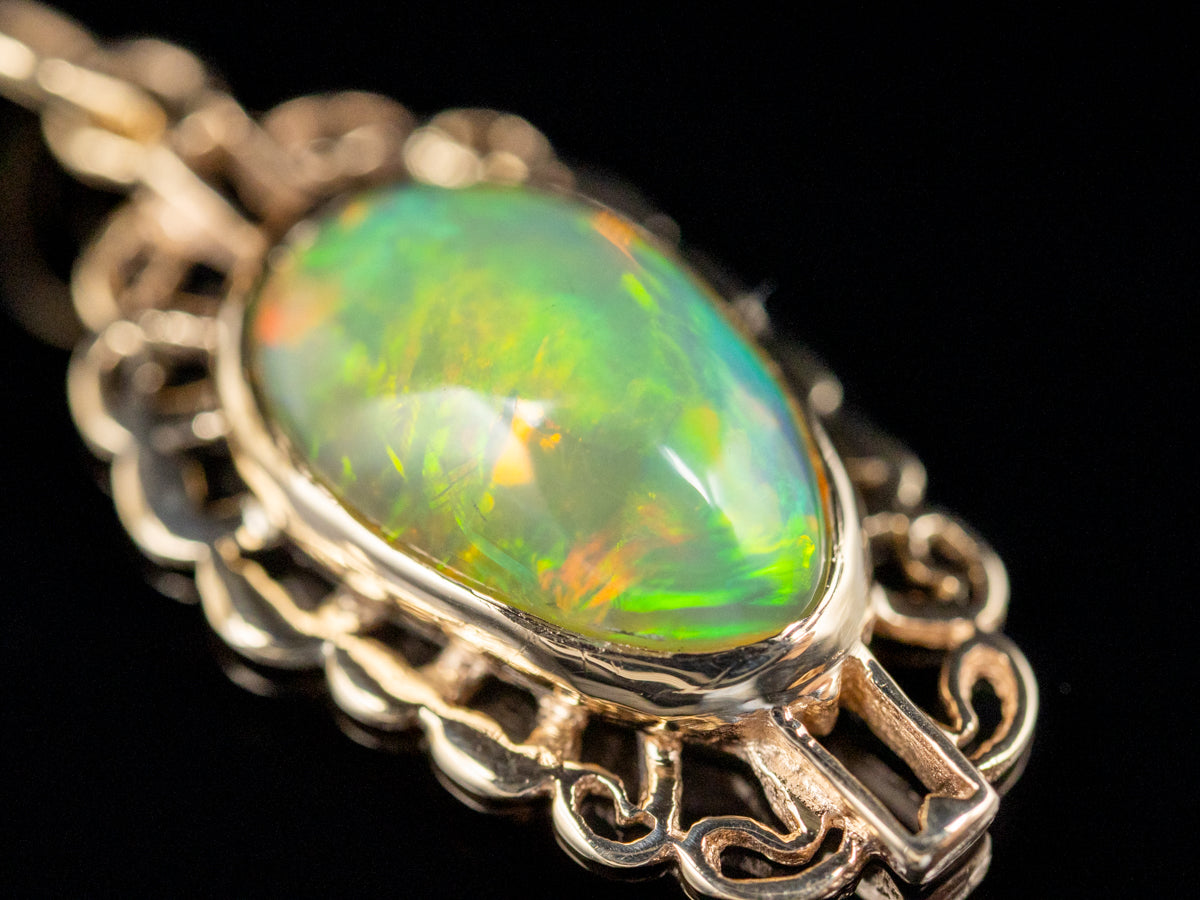 Looping Gold Opal Solitaire Pendant