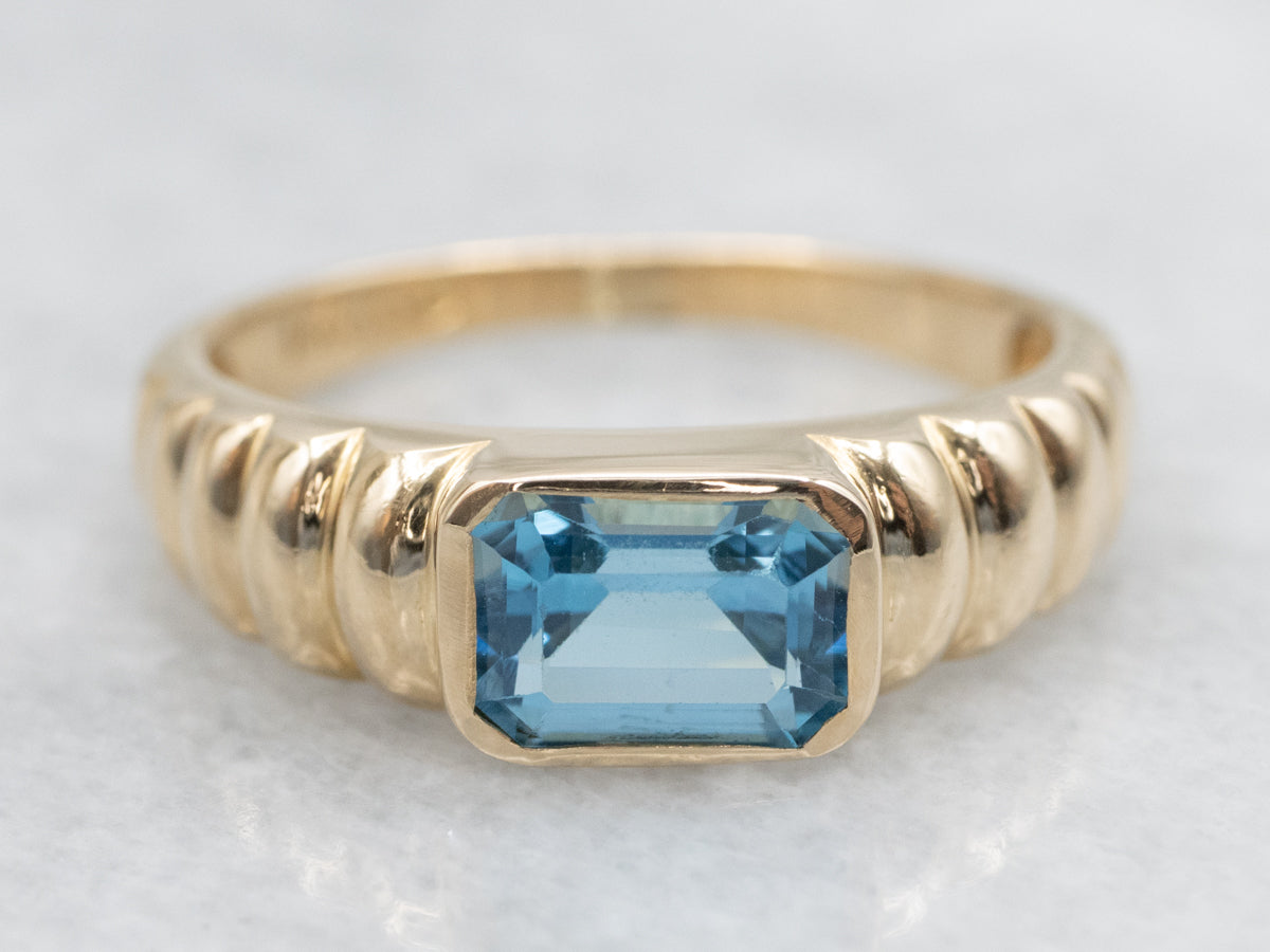 East-to-West Set Blue Topaz Gold Solitaire Ring