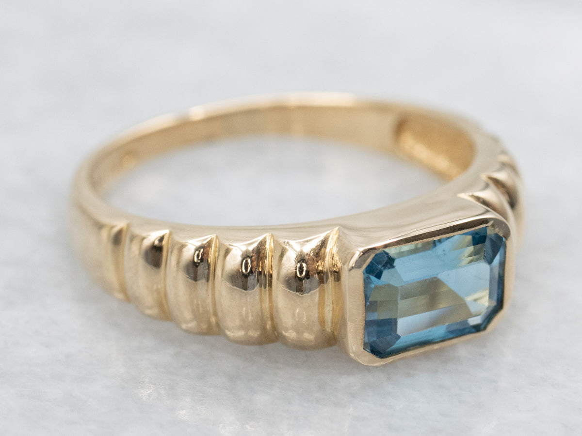 East-to-West Set Blue Topaz Gold Solitaire Ring