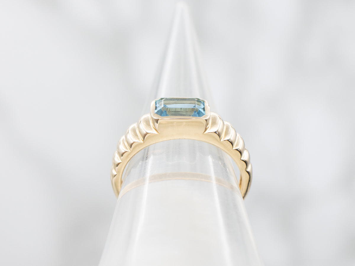East-to-West Set Blue Topaz Gold Solitaire Ring