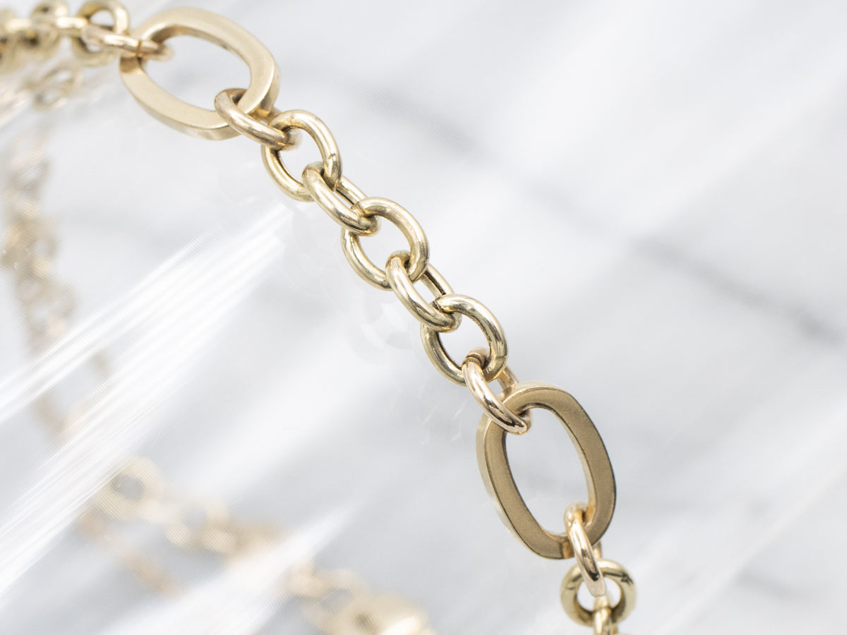 Gold Link Bracelet with Heart Lock Clasp and Safety Chain
