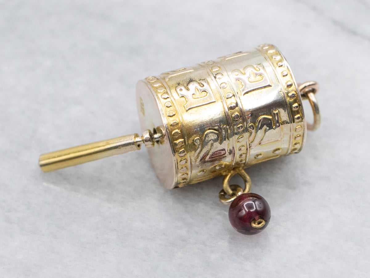 Vintage Gold Tibetan Prayer Wheel Pendant with Garnet
