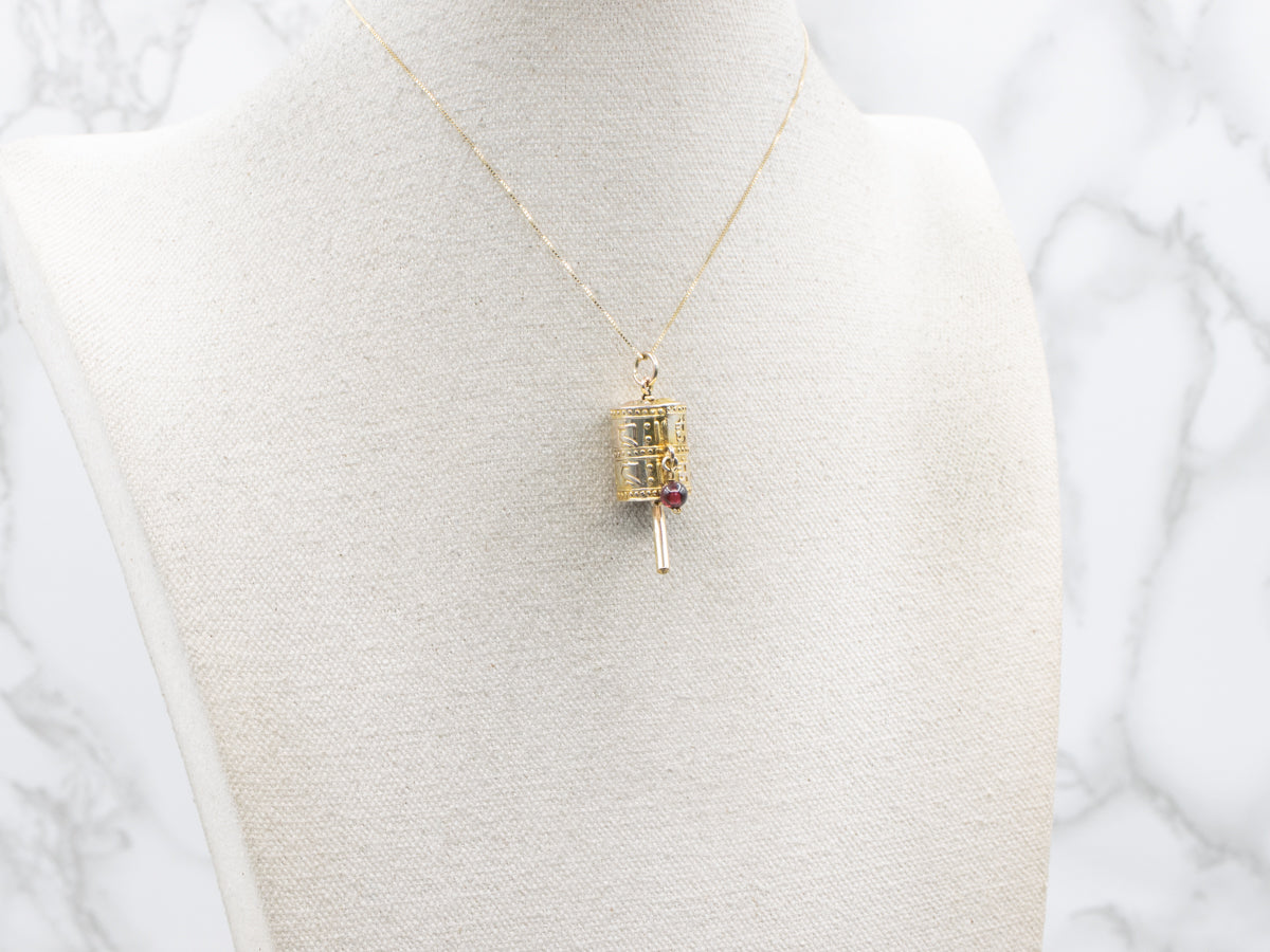 Vintage Gold Tibetan Prayer Wheel Pendant with Garnet