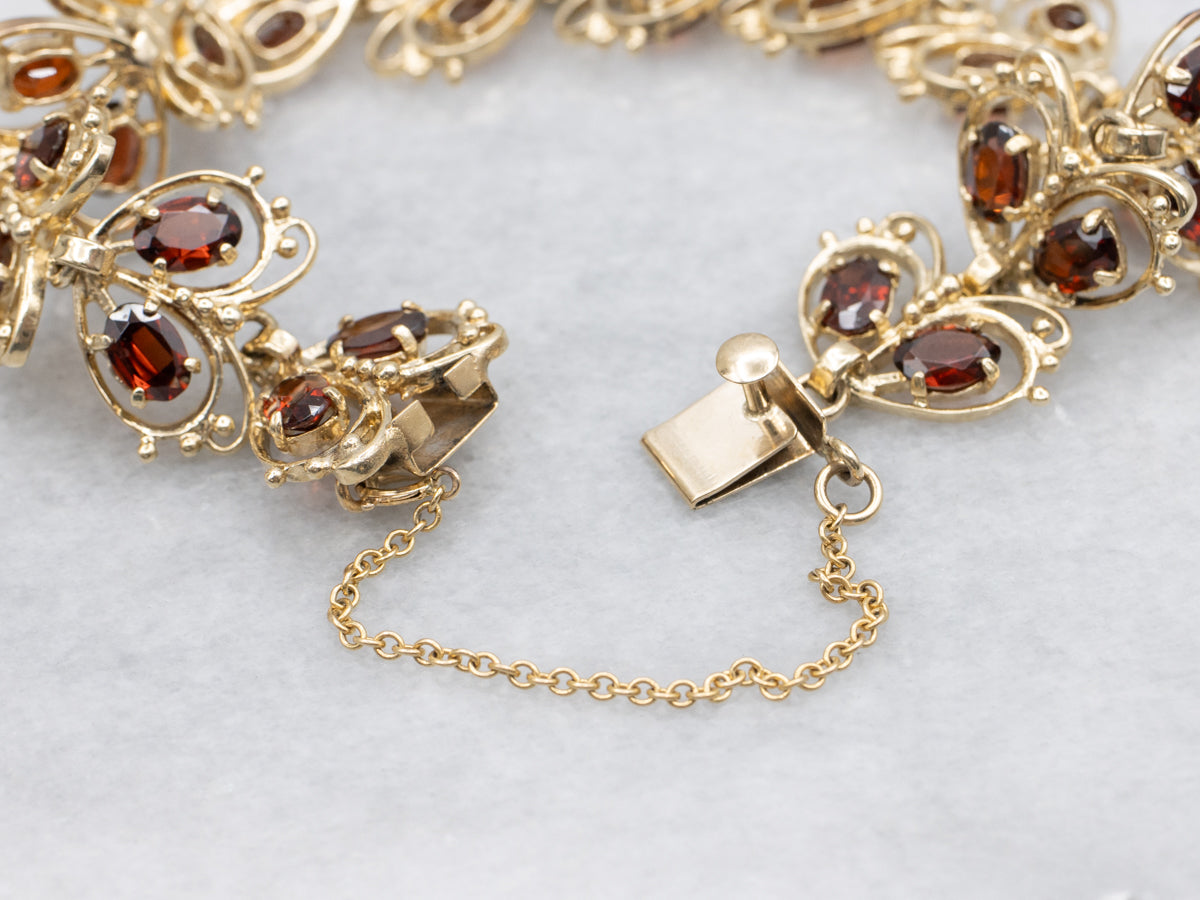 Looping Gold and Garnet Butterfly Link Bracelet