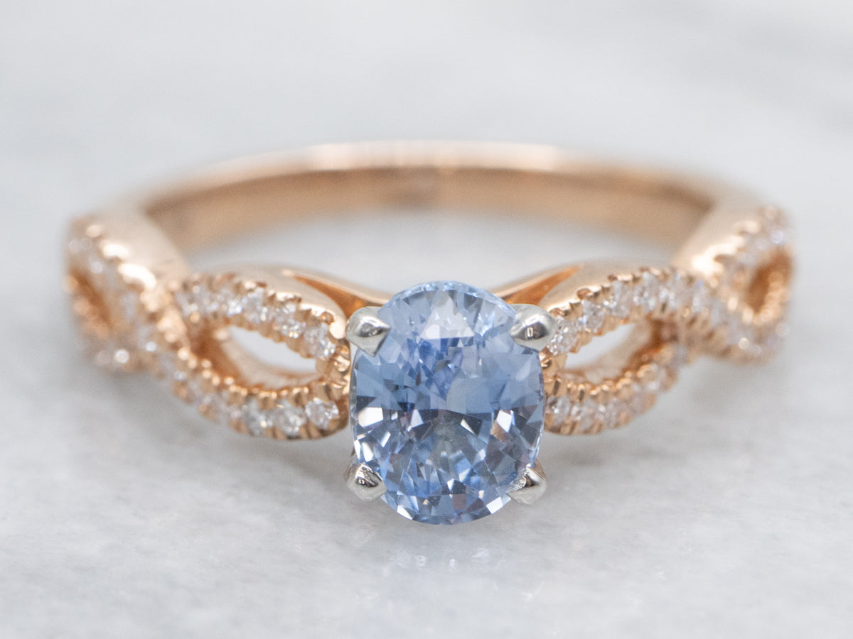 Modern Sapphire and Twisting Diamond Engagement Ring