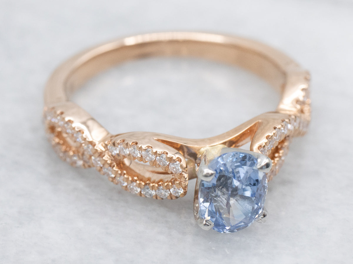 Modern Sapphire and Twisting Diamond Engagement Ring
