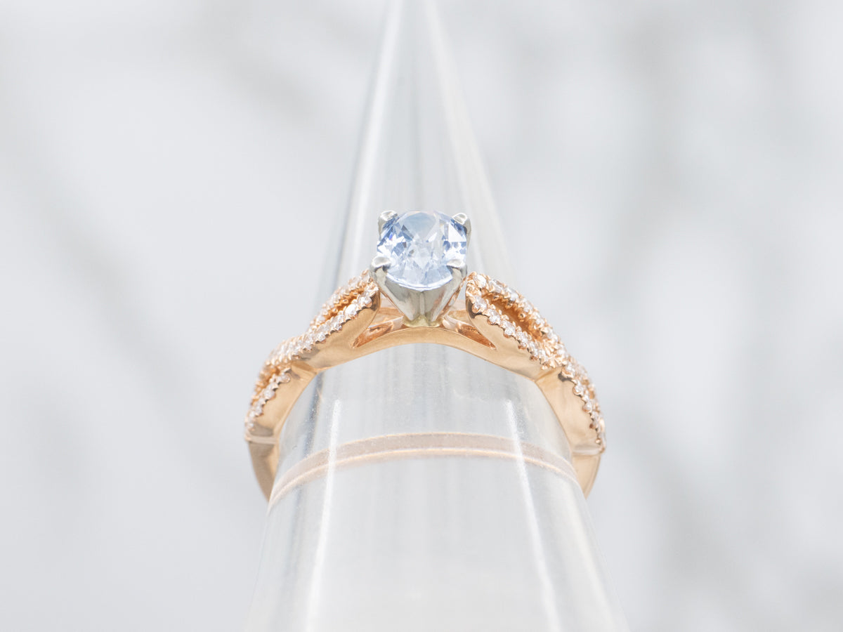 Modern Sapphire and Twisting Diamond Engagement Ring